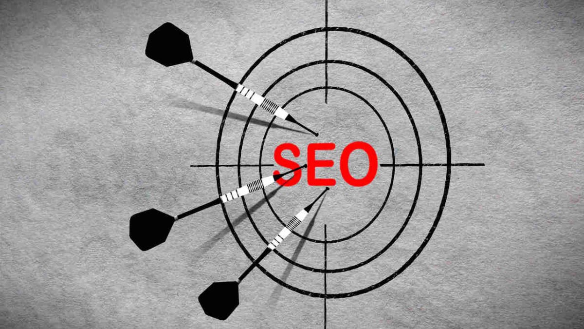 Darts on a bullseye with SEO text on it